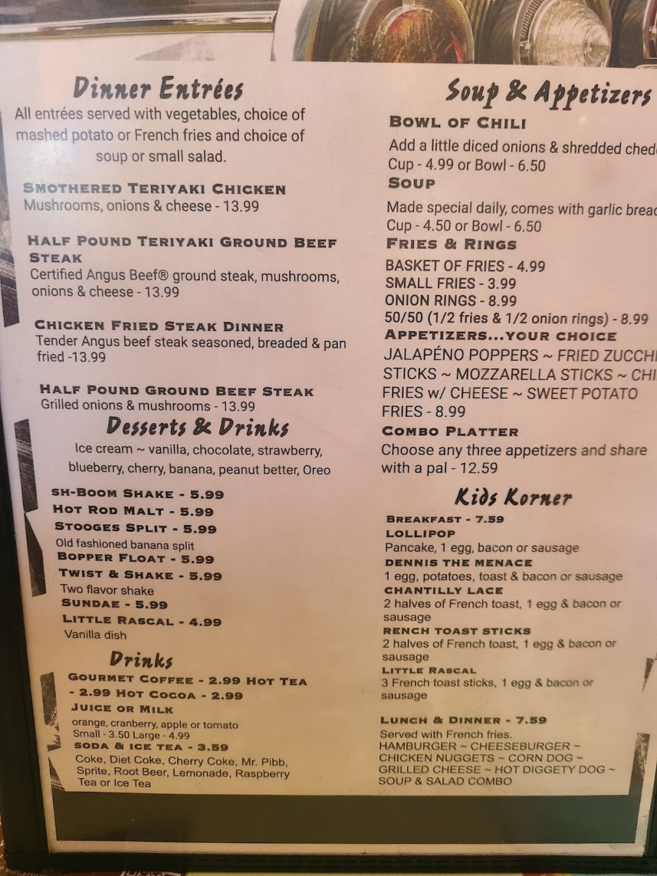 Soup menu beside a diner table.